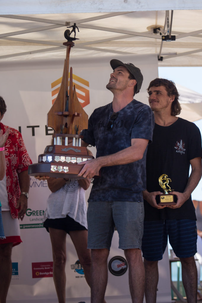 Tim MacDonald collects the winner's cheque and trophy. 